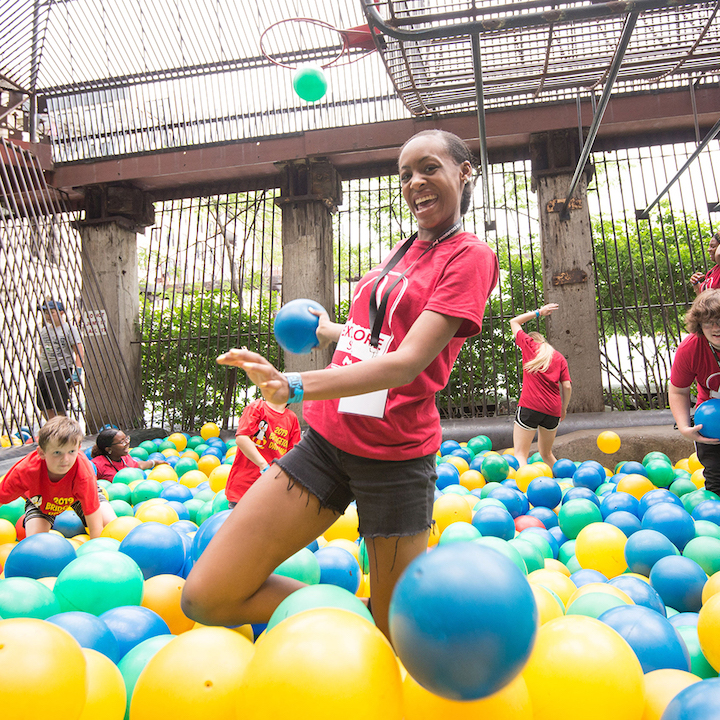 Students laughing in a ball pit at St. Louis' City Museum